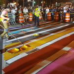 Members of New York City’s Department of Transportation paint the crosswalk outside of Stonewall Inn with the colors of the pride flag in honor of pride week on June 25, 2017 (<a href="https://twitter.com/Gastels/status/878821309274357760">Scott Gastel</a>)